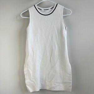 Athleta white and black sleeveless top with slots in the sides.
